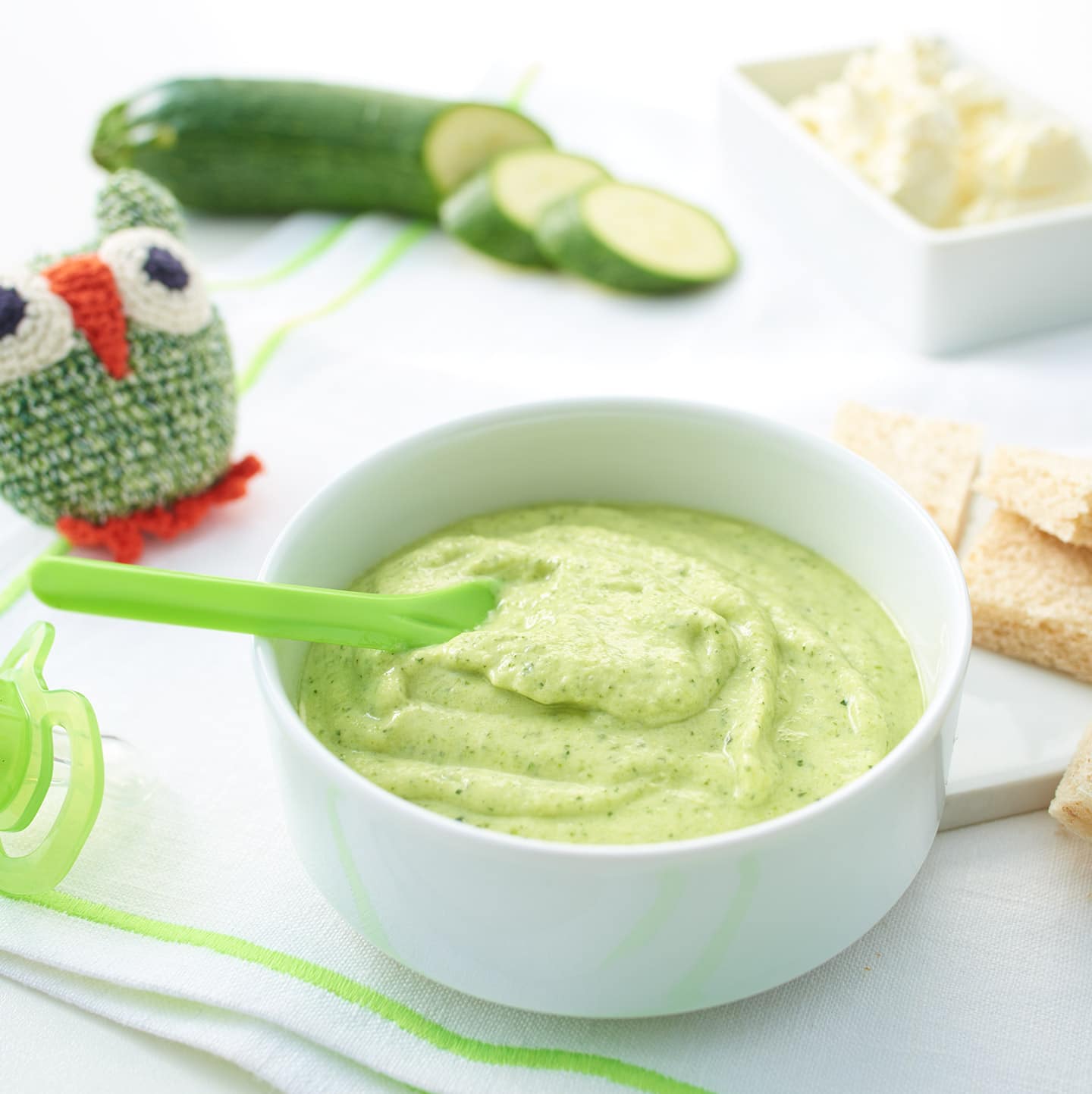 A Baby plate filled with fresh cucumber porridge and toast