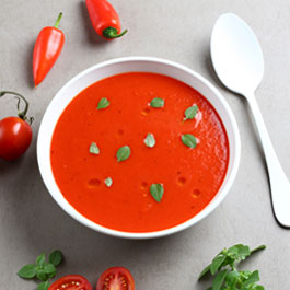 Chilled roasted pepper soup with tomatoes and basil