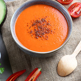 Mexican spiced red pepper & tomato soup with avocado and coriander yoghurt