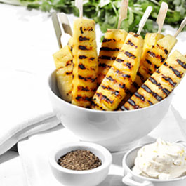 Spiced pineapple skewers with lemon and lime mascarpone cream