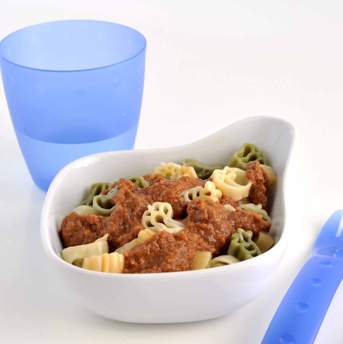 A kids bowl with spaghetti bolognese